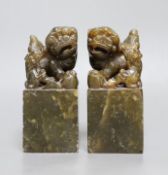 A pair of Chinese soapstone lion dog seals,15 cms high,