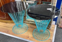 A pair of mid century style circular glass topped painted wrought iron occasional tables, diameter