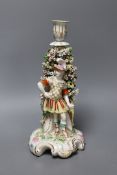 A Derby male bocage figural candlestick, c.1770,26 cms high,