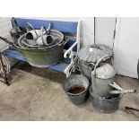 Ten assorted galvanised watering cans and containers, largest width 86cm