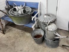 Ten assorted galvanised watering cans and containers, largest width 86cm
