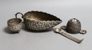 An Indian white metal gem set tasting cup, diameter 87mm, a sauce boat, salt and part of a pair of