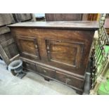 A mid 18th century fruitwood mule chest, adapted, with two panelled doors over three drawers,