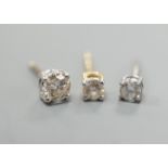 Two odd diamond set ear studs, the stones of various sizes and one paste set ear stud, gross
