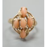 A modern 14k yellow metal and five stone oval coral bead set dress ring, size J/K, gross weight 2.