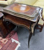 A 19th century gilt metal mounted birds eye maple and amboyna jardiniere table, bears Druce & Co
