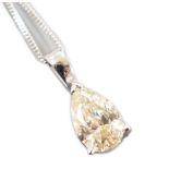 A modern white metal and light brown pear cut diamond set pendant, 14mm, on an 18ct white gold