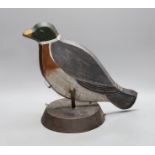 A painted wood pecking decoy bird,31 cms high,