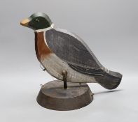 A painted wood pecking decoy bird,31 cms high,