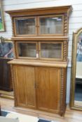 An early 20th century oak three part side cabinet, width 105cm, depth 47cm, height 188cm