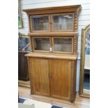 An early 20th century oak three part side cabinet, width 105cm, depth 47cm, height 188cm