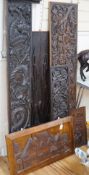 Seven assorted carved wooden panels,widest 166 cms,
