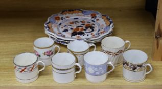 Seven early 19th century coffee cans and three Ridgway Imari style plates,plates 23 cms diameter,