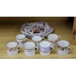 Seven early 19th century coffee cans and three Ridgway Imari style plates,plates 23 cms diameter,