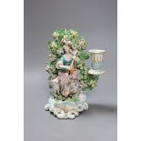 A Derby bocage candlestick, c.1770, modelled as a lady playing a lute,19cms high,