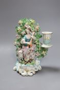 A Derby bocage candlestick, c.1770, modelled as a lady playing a lute,19cms high,