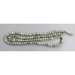 A Chinese jadeite bead necklace, 102cm.