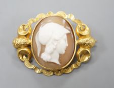 An early 20th century yellow metal mounted oval cameo shell brooch, carved with with the bust of a