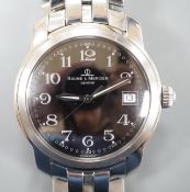 A gentleman's stainless steel Baume & Mercier quartz wrist watch, with black Arabic dial and date