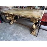 A pair of Renaissance style rectangular giltwood and composition centre tables, on chained eagle