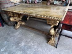 A pair of Renaissance style rectangular giltwood and composition centre tables, on chained eagle