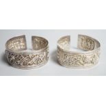A pair of early 20th century Chinese white metal bangles