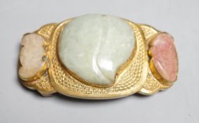 A Chinese jade and hardstone mounted belt buckle, late 19th/early 20th century the central green