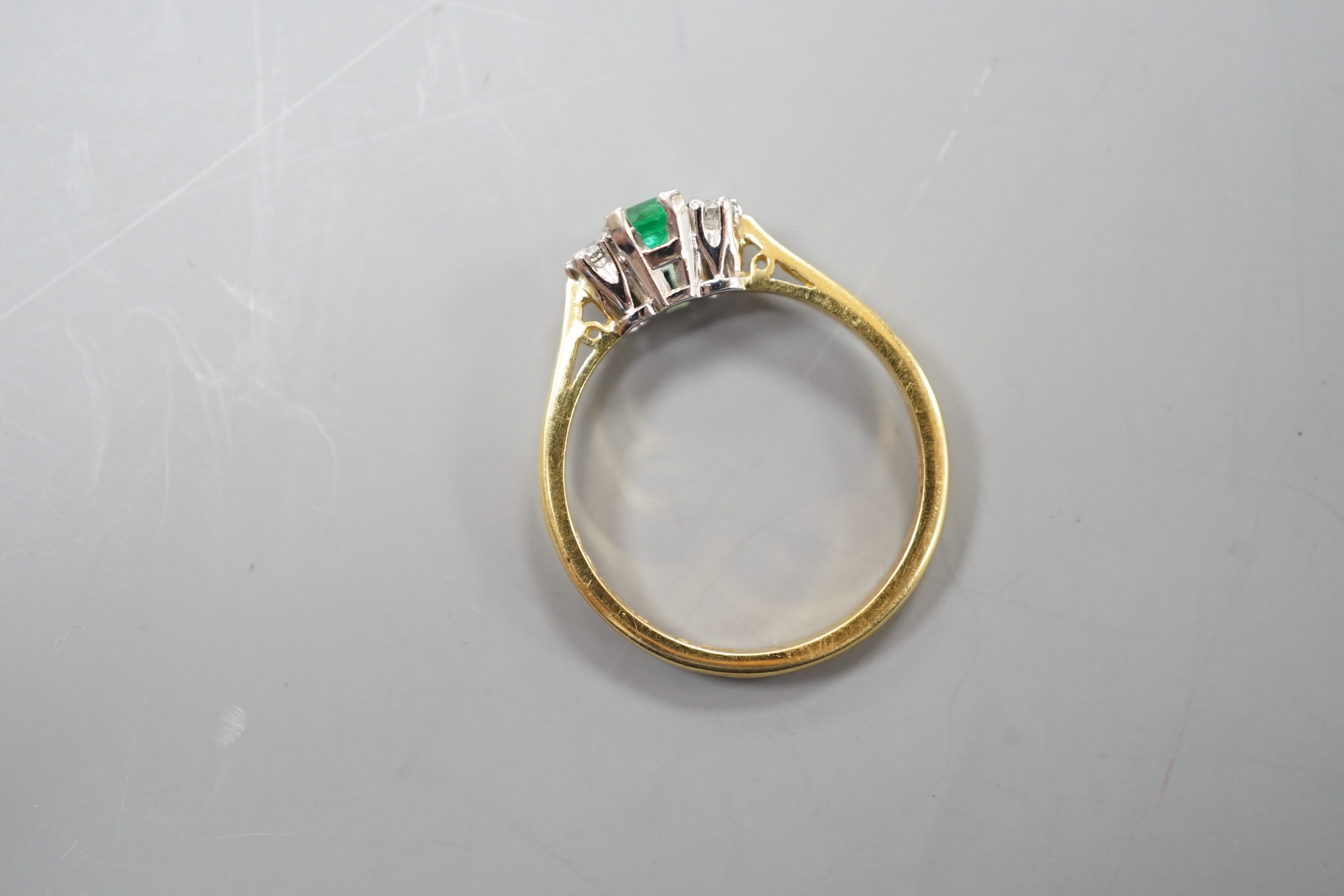 A modern 18ct gold, emerald and diamond set three stone ring, size N, gross weight 2.6 grams. - Image 3 of 3