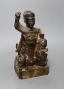 A Chinese Qing dynasty carved wood figure, 23cm tall