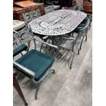 A Victorian style aluminium twin pedestal garden table and eight elbow chairs with seat pads,