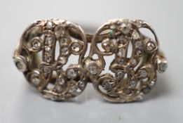 A 19th century white metal and rose cut diamond chip set monogram? ring, size L, gross weight 3