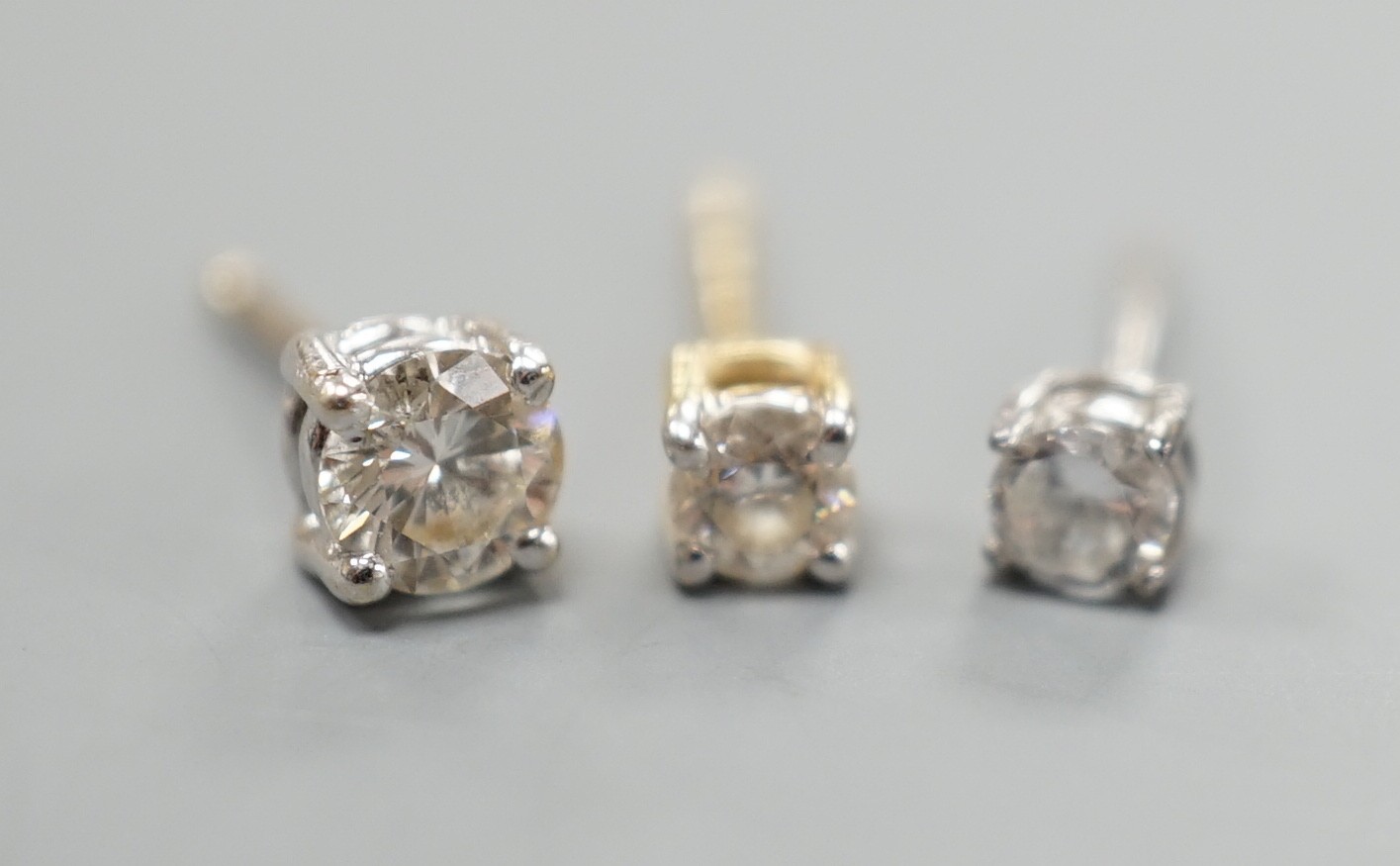 Two odd diamond set ear studs, the stones of various sizes and one paste set ear stud, gross - Image 2 of 5