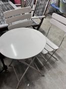 A circular painted metal folding garden table, diameter 60cm, height 71cm and two folding chairs