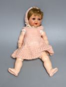 A Heubach Koppelsdorf open mouthed bisque headed doll,34 cms high,