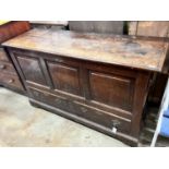 A mid 18th century oak mule chest with squared triple panelled front, width 151cm, depth 50cm,