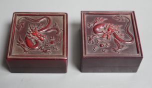 A selection of two oriental seals in dragon relief boxes, 6.5cm wide
