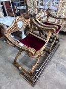 A pair of Renaissance style giltwood and composition X frame elbow chairs, on lion's paw feet, width