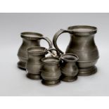 A set of six graduated pewter tankards,tallest 16 cms high,