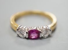 A modern 18ct white gold pink sapphire and diamond set three stone ring, size M, gross weight 4