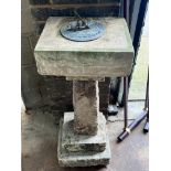 A sectional carved stone sundial with cast brass scale and gnomon, height 96cm