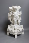 A Meissen style figural centrepiece, stem emblematic of the four seasons,43 cms high,