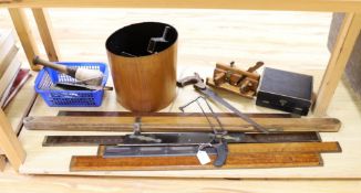 A leather writing box, a collection of wooden rulers, a small collection of wood working and