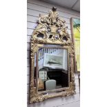An early 19th century French carved giltwood and gesso wall mirror, with rectangular and marginal