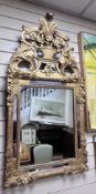 An early 19th century French carved giltwood and gesso wall mirror, with rectangular and marginal