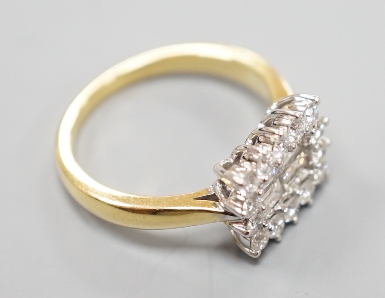 A 750 yellow metal, baguette and round cut diamond set rectangular cluster ring, size M, gross - Image 6 of 6