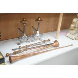 A pair of Arts and Crafts copper and iron fire dogs together with copper coaching horns, etc. (