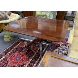 A Regency rectangular mahogany snap top breakfast table on brass casters, width 128cm depth 109cm