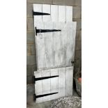 Five assorted Victorian and later painted pine doors, larger width 83cm height 163cm