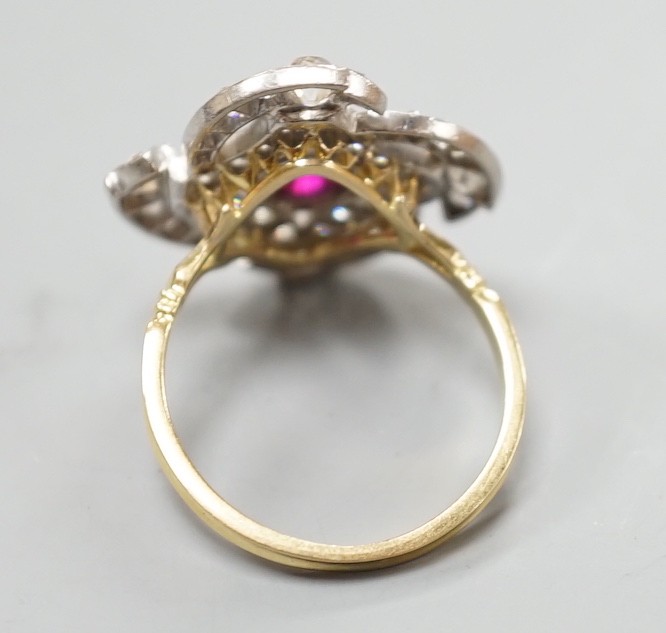 A yellow metal, ruby and diamond cluster set dress ring, in a pierced scroll setting, size O, - Image 4 of 5