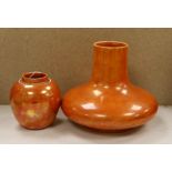 A Ruskin orange lustre vase, dated 1914 and a similar ginger jar, dated 1920, tallest 19cm